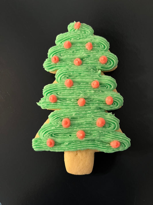 Christmas cutout cookies (trees, mittens, santa hats) with buttercream icing.