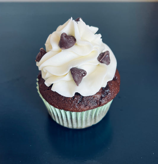 Cookie Dough Cupcake - chocolate or vanilla cupcake filled with cookie dough, topped with buttercream icing & chocolate chips.
