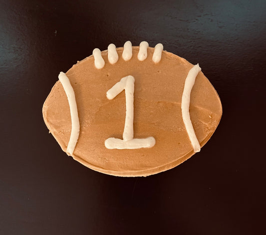 Football cutout cookies with buttercream icing. Colors may vary.(4"X4")