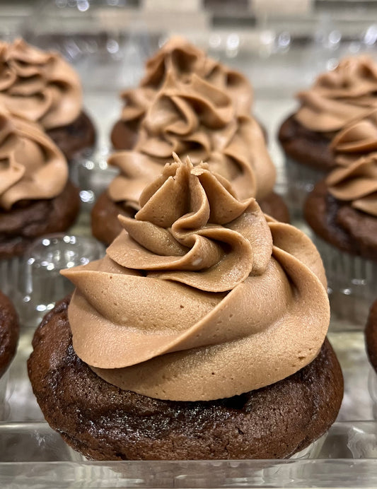 Chocolate - A rich chocolate cupcake with chocolate buttercream icing.  Speciality option - filled with chocolate icing and chocolate drizzle.
