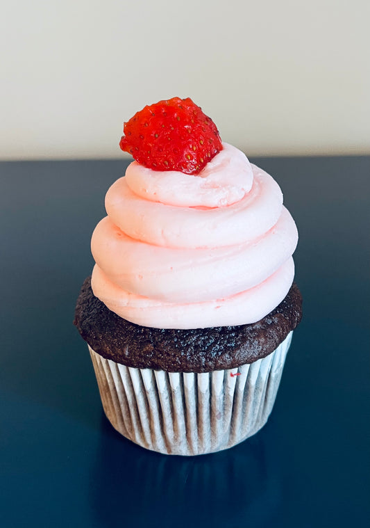 Chocolate Strawberry - A rich chocolate cupcake, topped with strawberry buttercream icing and a strawberry.  Speciality option - topped with strawberry drizzle and filled with strawberry jam. (Also available in vanilla)