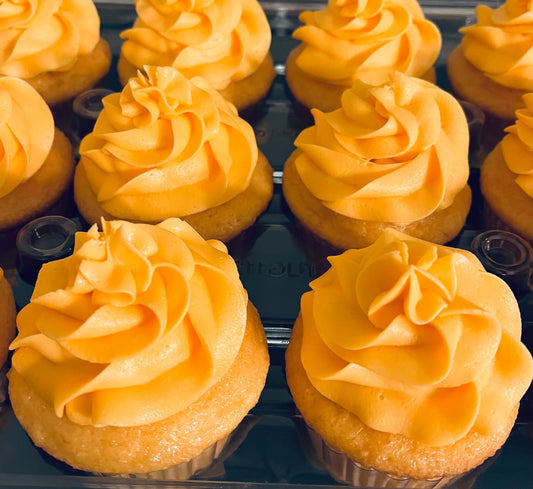 Orange Creamsicle-A rich orange cake with orange cream cheese icing. Speciality option - filled with cream cheese icing.